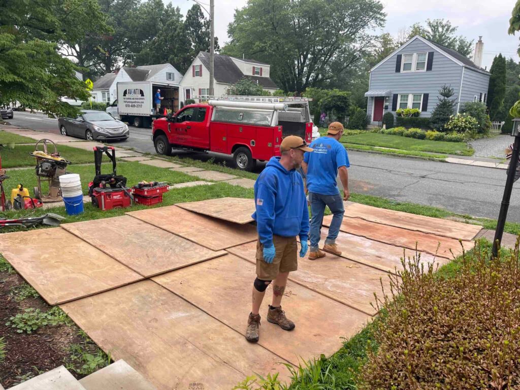Avanti plumbers excavating to repair a sewer line