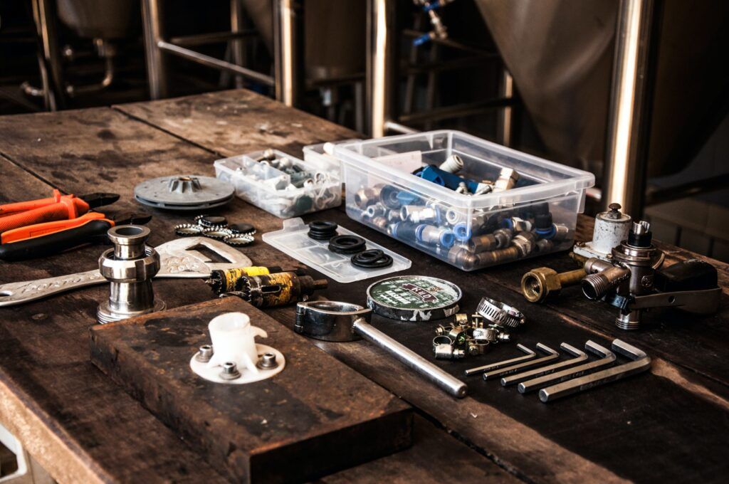 Plumbing tools and fittings on a workbench