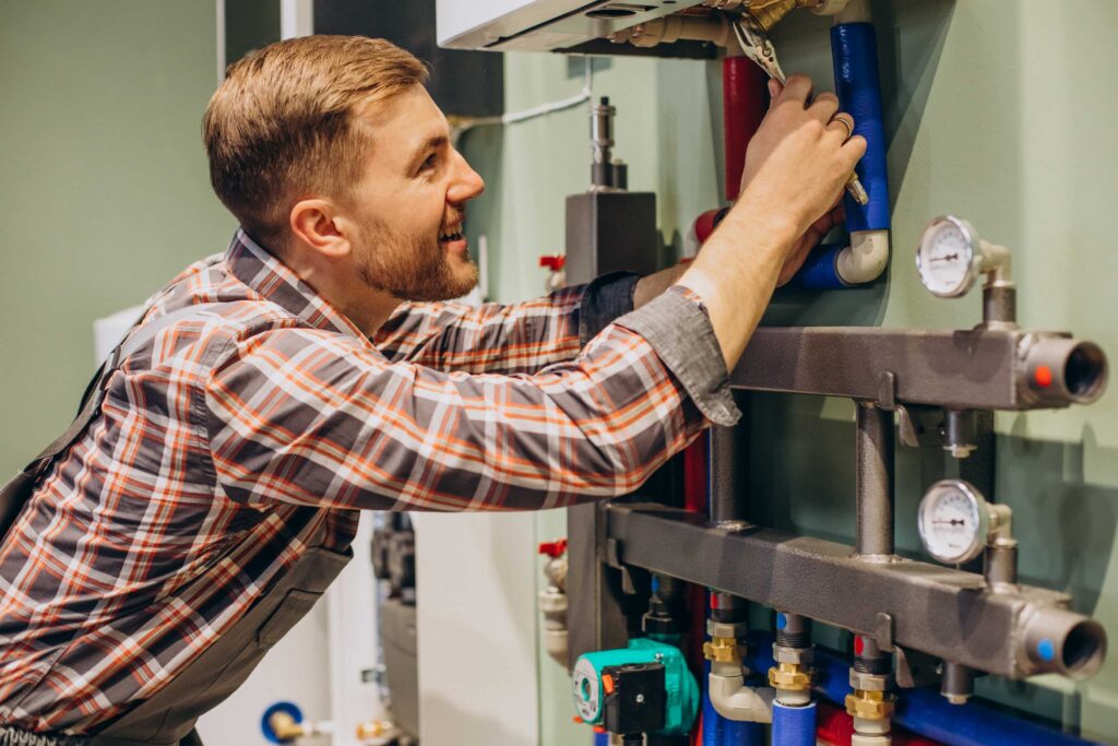 Technician adjusting a home heating system