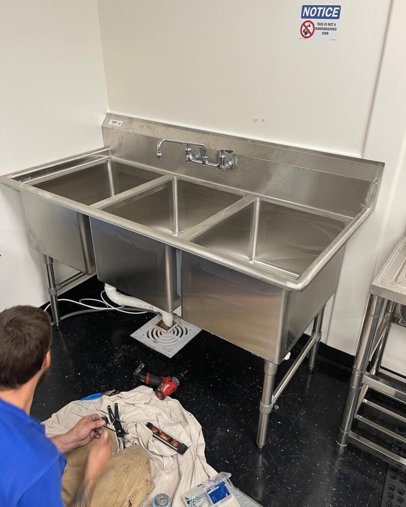 Newly installed stainless steel utility sink